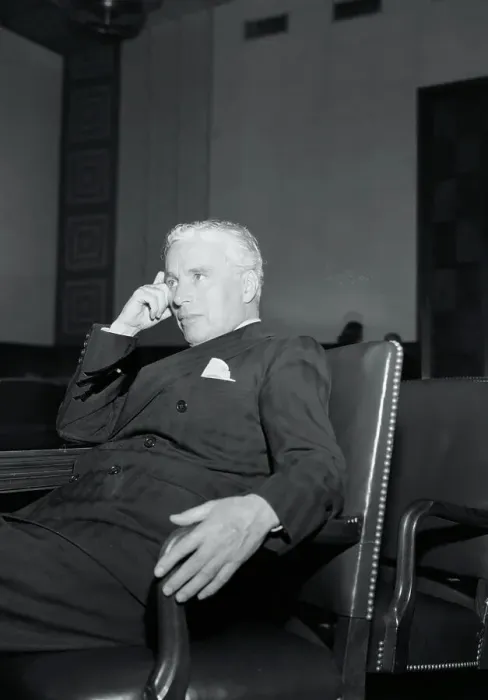 Framed Print : Charlie Chaplin Resting in a Chair Framed Print : Charlie Chaplin Resting in a Chair