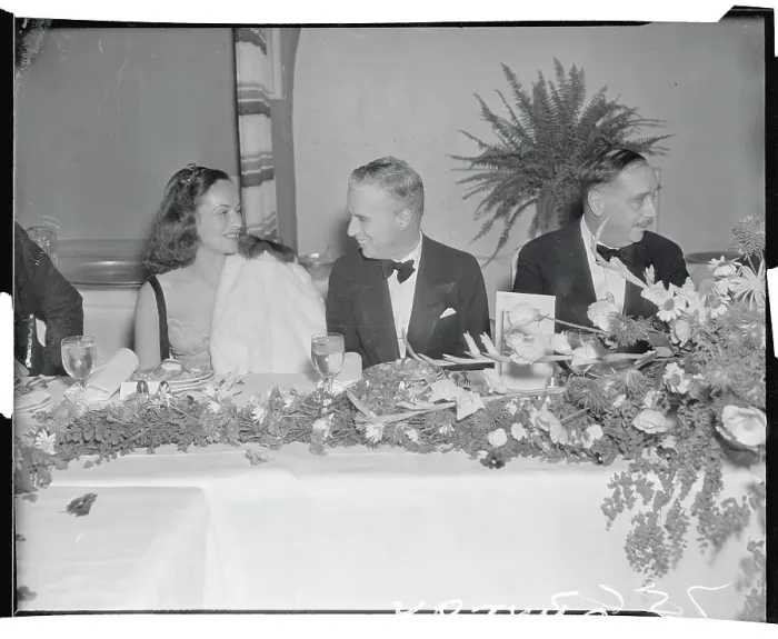 Framed Print : Charlie Chaplin Speaking with Paulette Goddard Framed Print : Charlie Chaplin Speaking with Paulette Goddard