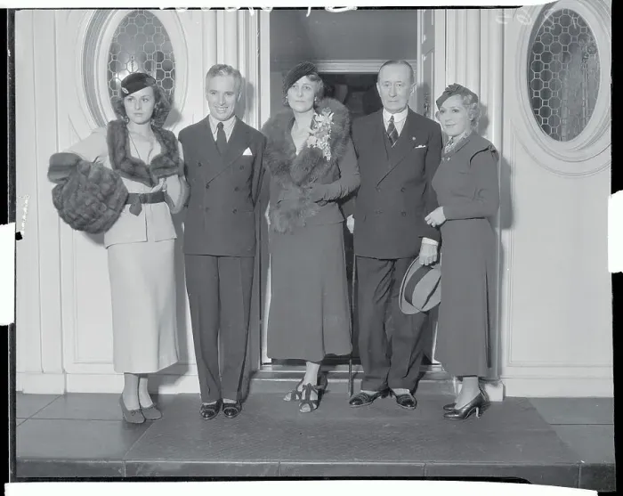 Framed Print : Charlie Chaplin Standing with Others Framed Print : Charlie Chaplin Standing with Others