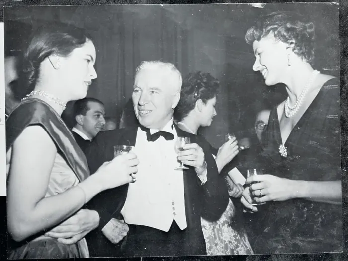 Framed Print : Charlie Chaplin Talking with Women Framed Print : Charlie Chaplin Talking with Women
