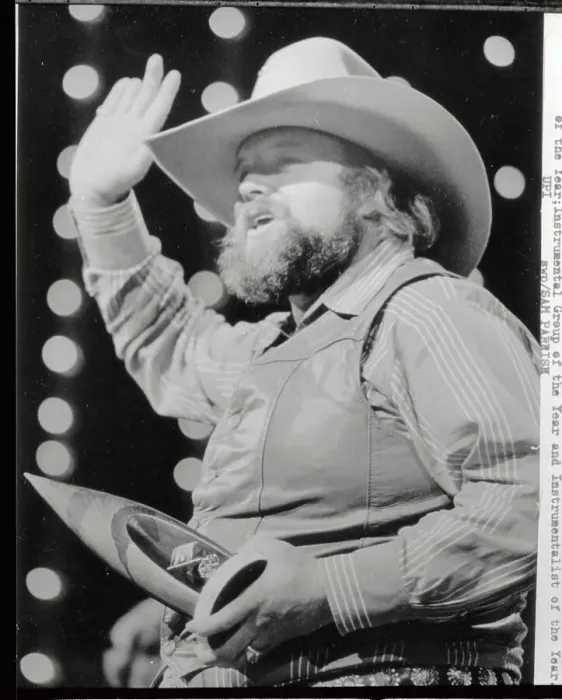 Framed Print : Charlie Daniels Holding Award and Waving Framed Print : Charlie Daniels Holding Award and Waving
