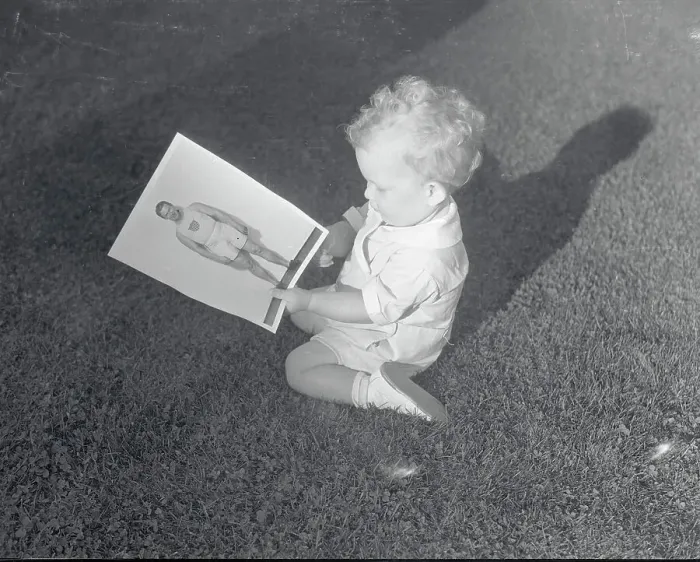 Framed Print : Charlie Paddock's Son Admiring Picture Framed Print : Charlie Paddock's Son Admiring Picture