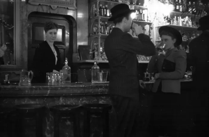 Framed Print : Cheers. 26th November 1938: A man and woman drinking at the bar of an English pub Framed Print : Cheers. 26th November 1938: A man and woman drinking at the bar of an English pub