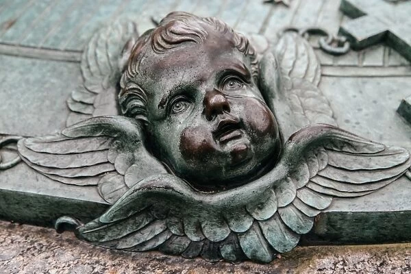 Cherubs face on a grave of Augustin EhrensvAÔé¼rd at Suomenlinna, Finland