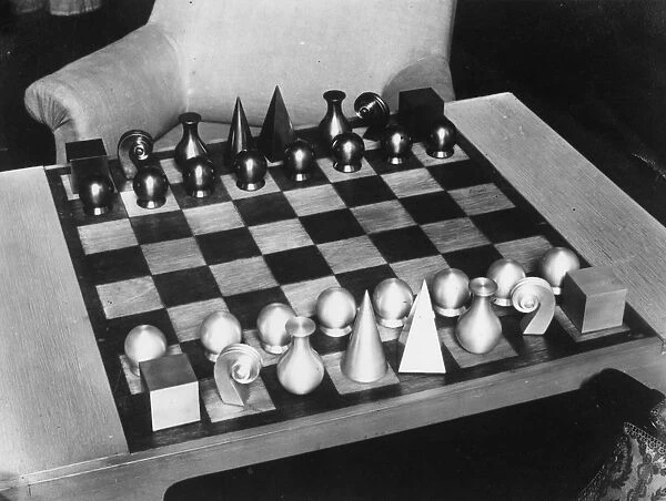 Chess Set. circa 1960: A geometric chess set ready for a game