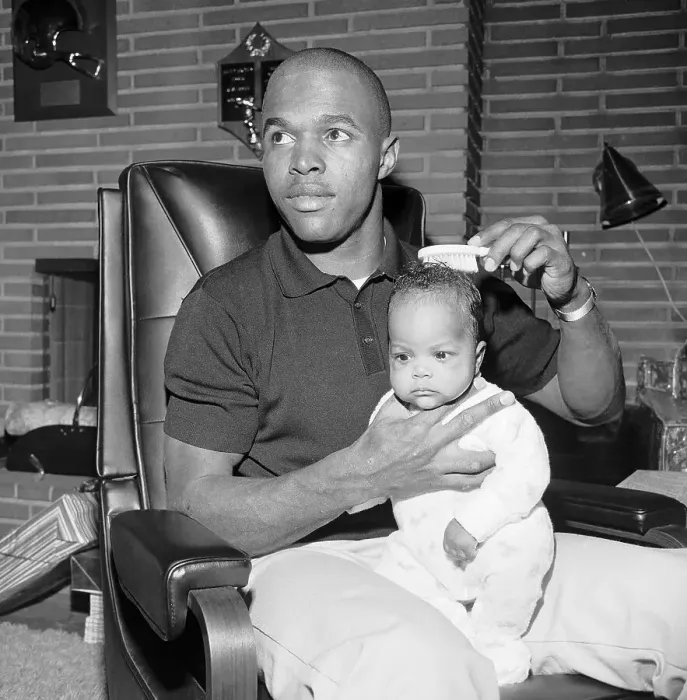 Framed Print : Chicago Bears Gale Sayers Brushes His Daughter's Hair Framed Print : Chicago Bears Gale Sayers Brushes His Daughter's Hair