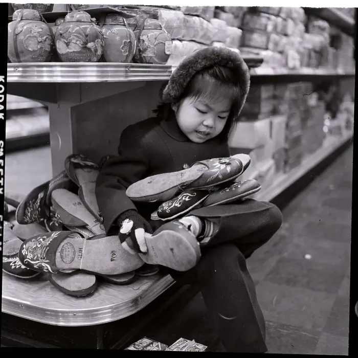Framed Print : Child Fiddling With Chinese Slippers Framed Print : Child Fiddling With Chinese Slippers