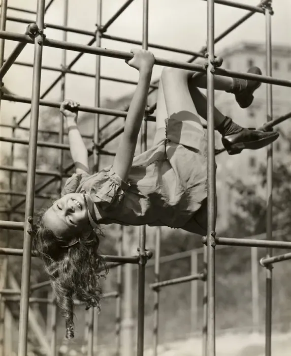 Framed Print : Child girl hanging upside down on jungle gym Framed Print : Child girl hanging upside down on jungle gym