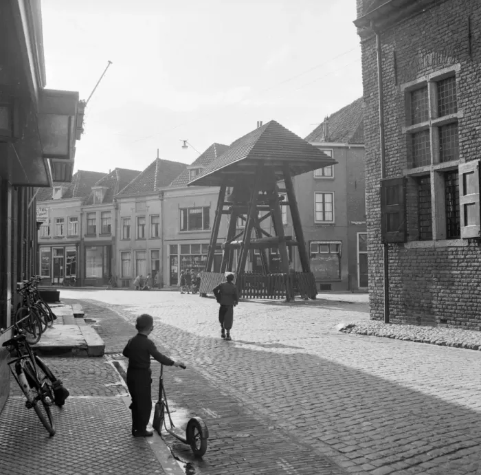 Framed Print : A child of the Haanapel family holds his scooter and watches the street in the town of Doesburg Framed Print : A child of the Haanapel family holds his scooter and watches the street in the town of Doesburg