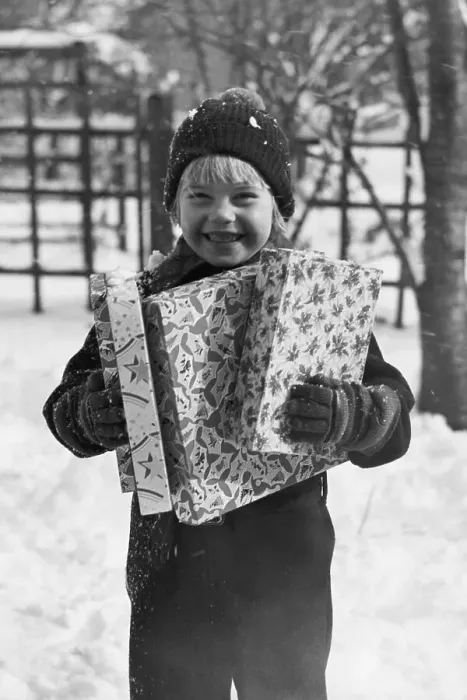 Framed Print : Child Holding Christmas Gifts
