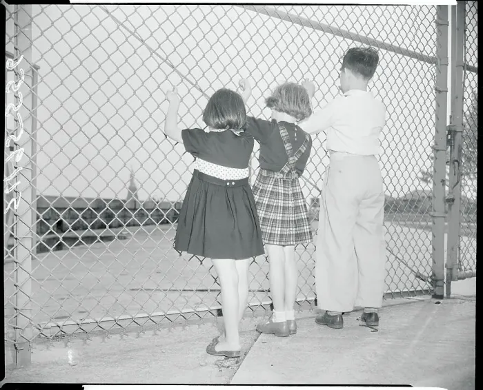 Framed Print : Child Immigrants Looking Through Fence Framed Print : Child Immigrants Looking Through Fence