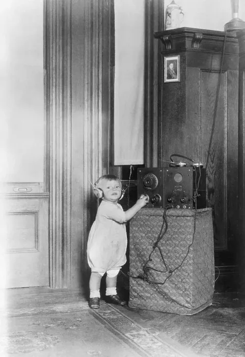 Framed Print : Child Listening to a Radio Framed Print : Child Listening to a Radio