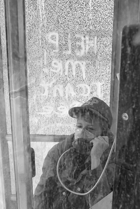 Framed Print : Child Makes Phone Call With Air Mask