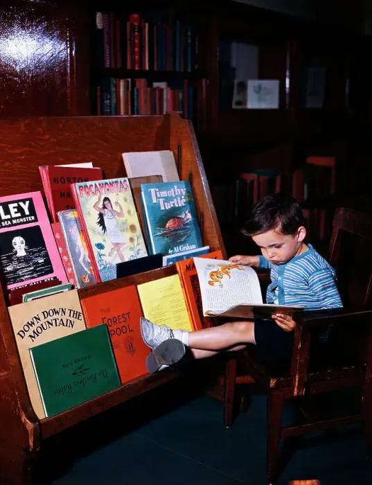 Framed Print : Child Reading at the Library Framed Print : Child Reading at the Library