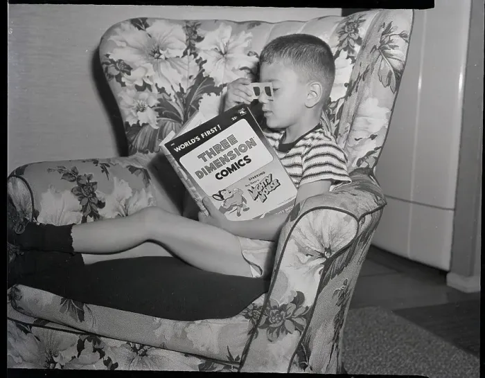 Framed Print : Child In Seat Reading 3D Comic Framed Print : Child In Seat Reading 3D Comic