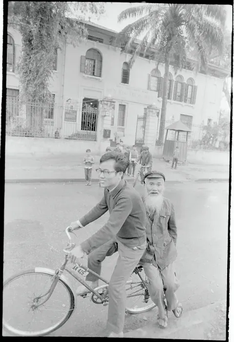 Framed Print : Child Transporting Grandfather on Bicycle Framed Print : Child Transporting Grandfather on Bicycle