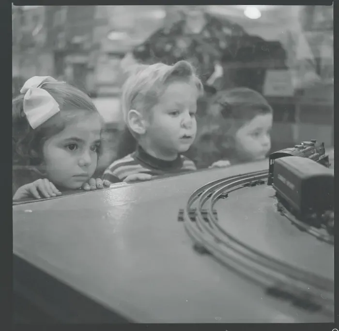Framed Print : Children Admiring Electric Train Framed Print : Children Admiring Electric Train