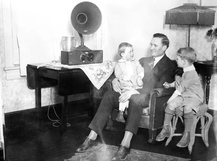 Framed Print : Children and Their Dad at Home Listening to Radio Framed Print : Children and Their Dad at Home Listening to Radio