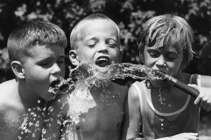 Framed Print : Children Drinking from Garden Hose Framed Print : Children Drinking from Garden Hose