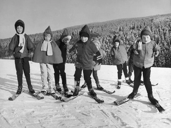 Framed Print : Children Learning to Move on Skis