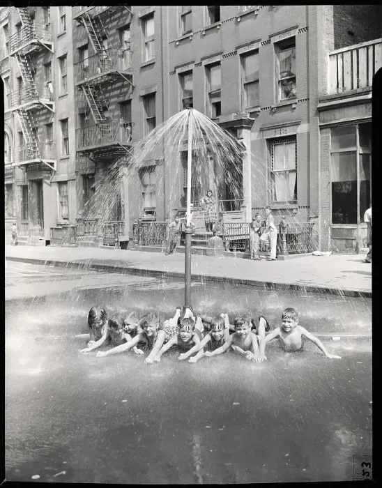 Framed Print : Children Lying Under a Sprinkler on a Hot Day Framed Print : Children Lying Under a Sprinkler on a Hot Day