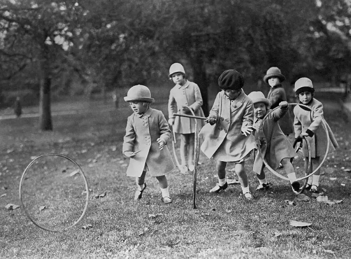 Framed Print : Children Play With Hoops In The Park Framed Print : Children Play With Hoops In The Park