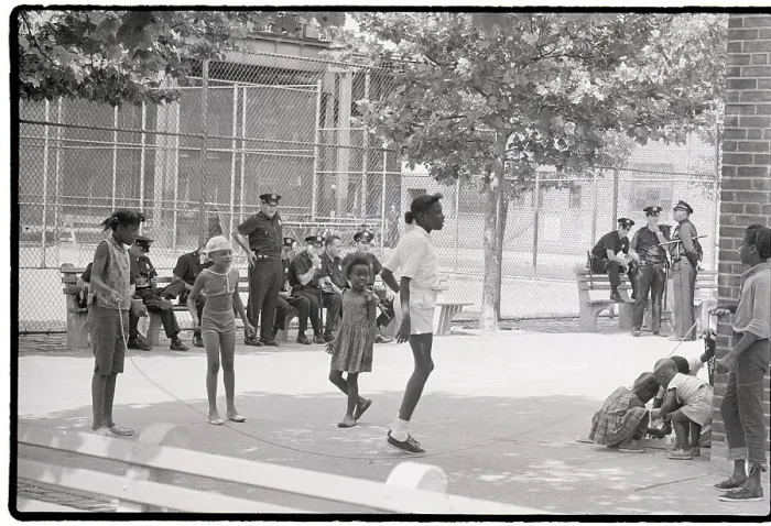 Framed Print : Children Playing Near Group of Police Officers Framed Print : Children Playing Near Group of Police Officers