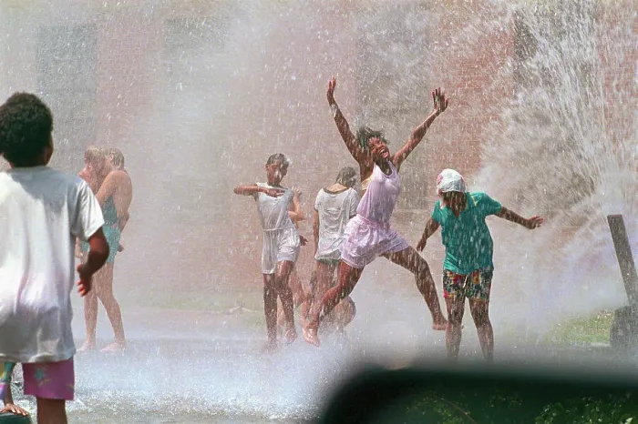 Framed Print : Children Playing in Water Spray