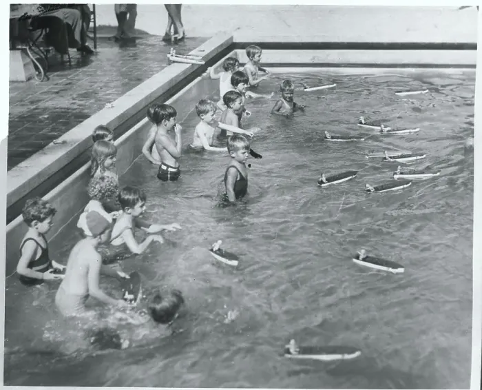 Framed Print : Children Racing Boats in Pool