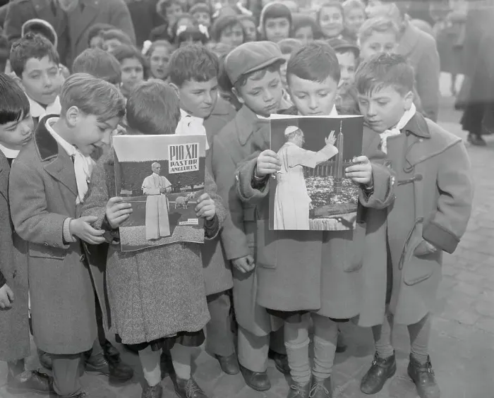 Framed Print : Children Reading Pamphlets Framed Print : Children Reading Pamphlets