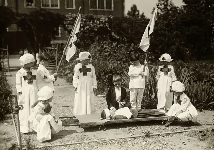 Framed Print : Children Staging Red Cross First Aid Drill During World War I Framed Print : Children Staging Red Cross First Aid Drill During World War I