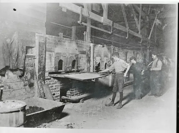 Framed Print : Children Stoking Furnace in Glass Factory