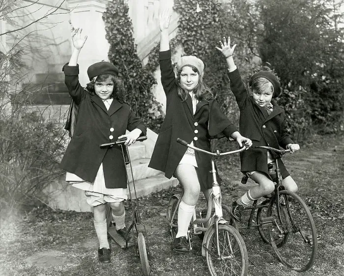 Framed Print : Children Waving from Bikes Framed Print : Children Waving from Bikes