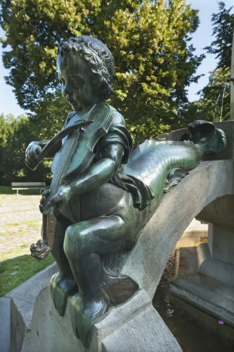 Framed Print : Childs sculpture with musical instrument and fish fin on Minnesangerbrunnen fountain, art nouveau, 1905, Rosenaupark, Nuremberg, Middle Franconia, Bavaria, Germany