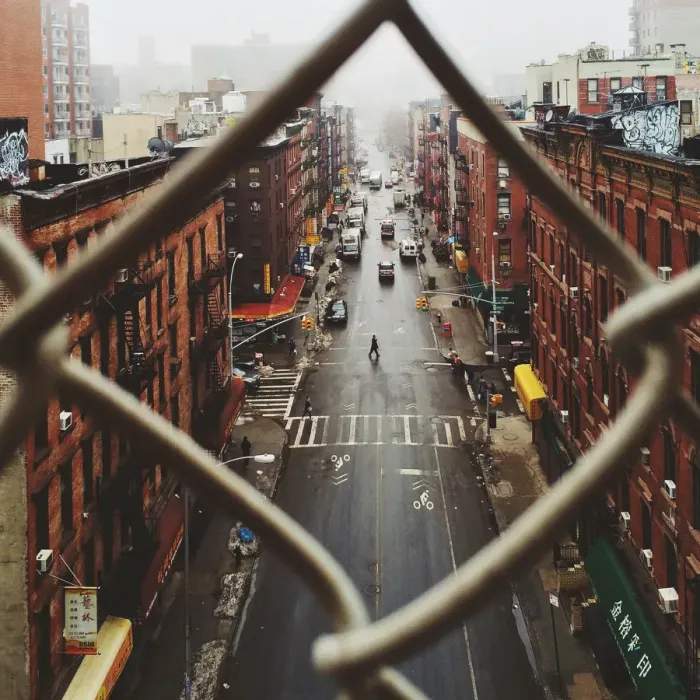 Framed Print : Chinatown seen through fence on a foggy day, NYC Framed Print : Chinatown seen through fence on a foggy day, NYC