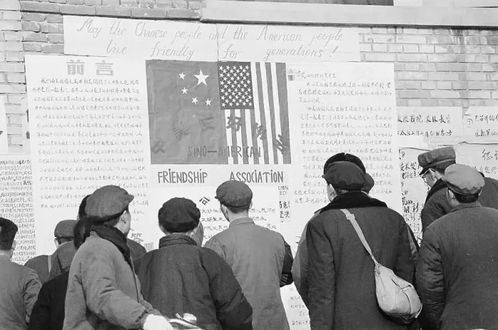 Framed Print : Chinese Citizens Reading Sign on US Embassy Wall