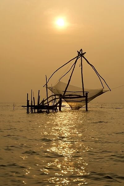 Chinese fishing net at sunrise, Vembanad lake, Kerala, India