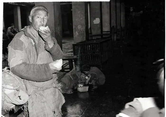 Framed Print : Chinese Man In Tattered Clothes Eating Framed Print : Chinese Man In Tattered Clothes Eating