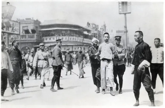 Framed Print : Chinese Rebel Being Led Away By Police Framed Print : Chinese Rebel Being Led Away By Police