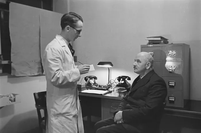 Framed Print : Chiropodist And Patient