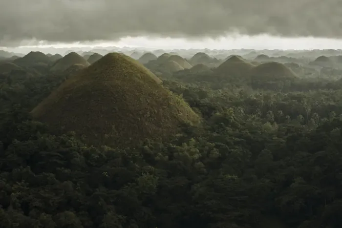 Framed Print : Chocolate hills landscape from Bohol Island, a big storm covers the sky making an interesting lighting effect Framed Print : Chocolate hills landscape from Bohol Island, a big storm covers the sky making an interesting lighting effect