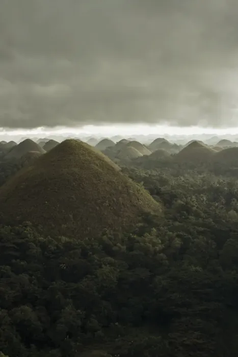 Framed Print : Chocolate hills landscape from Bohol Island, a big storm covers the sky making an interesting lighting effect Framed Print : Chocolate hills landscape from Bohol Island, a big storm covers the sky making an interesting lighting effect