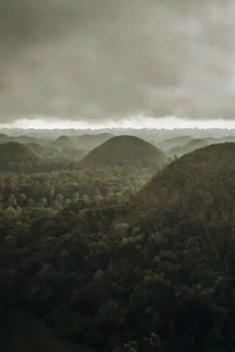 Framed Print : Chocolate hills landscape from Bohol Island, a big storm covers the sky making an interesting lighting effect Framed Print : Chocolate hills landscape from Bohol Island, a big storm covers the sky making an interesting lighting effect