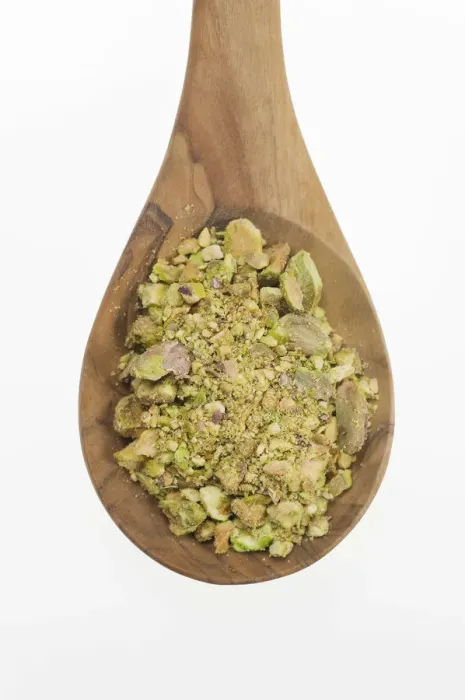 Framed Print : Chopped Pistachio (Pistacia vera) nuts on an olive wood spoon Framed Print : Chopped Pistachio (Pistacia vera) nuts on an olive wood spoon