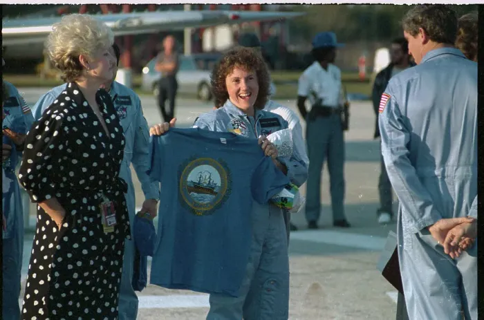 Framed Print : Christa McAuliffe Holding T-shirt Framed Print : Christa McAuliffe Holding T-shirt