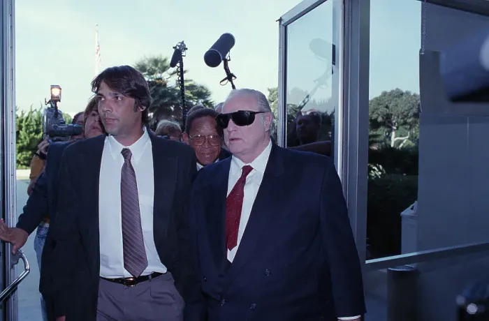 Framed Print : Christian Brando and Marlon Brando Walk with Press