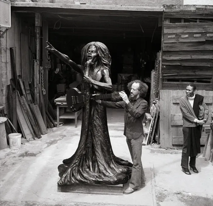 Framed Print : Christopher Gonzalez Examines Bob Marley Monument Which He Created