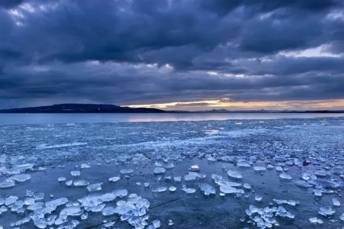 Framed Print : Chunks of ice lying on icy surface on the shore of Reichenau Island, Baden-Wuerttemberg, Germany, Europe Framed Print : Chunks of ice lying on icy surface on the shore of Reichenau Island, Baden-Wuerttemberg, Germany, Europe