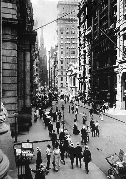 circa 1910: Wall Street facing south towards Trinity Church