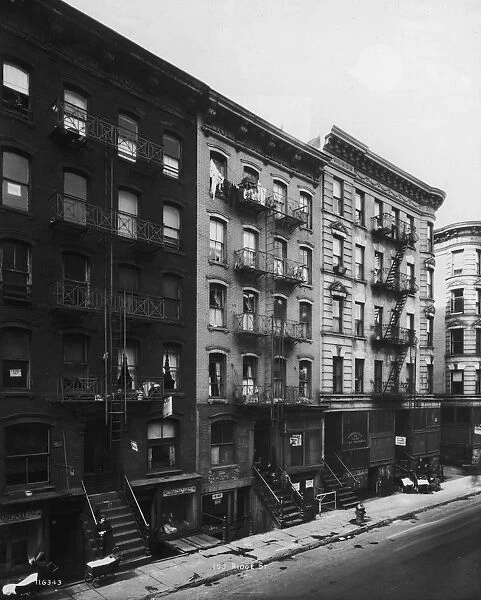 circa 1935: Exterior view of tenement buildings along Ridge Street on the Lower East Side